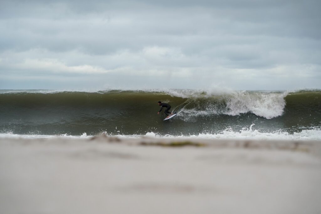 Mikey C pulling into a barrel in the Rip Curl Flashbomb wetsuit.