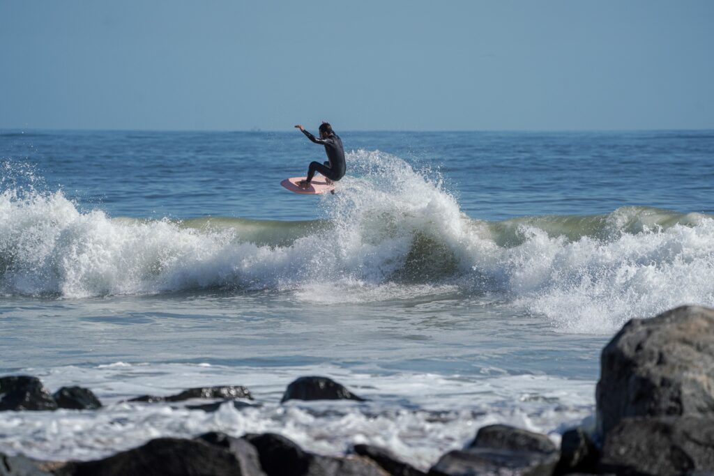 Mikey C airing out his Manera Seafarer wetsuit above the lip.